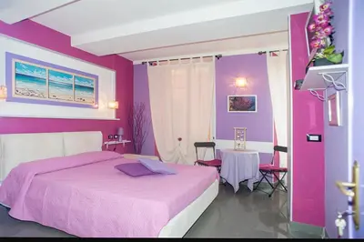 Letto o letti in una camera di I Coralli rooms & apartments