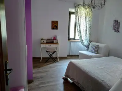 Letto o letti in una camera di La Pomella