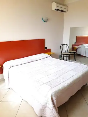 Letto o letti in una camera di Affittacamere Cigole