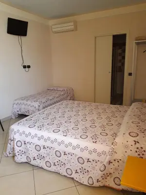 Letto o letti in una camera di Affittacamere Cigole
