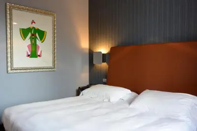 Letto o letti in una camera di Hotel Moderno