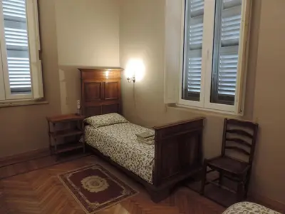 Letto o letti in una camera di Casa Mappamondo
