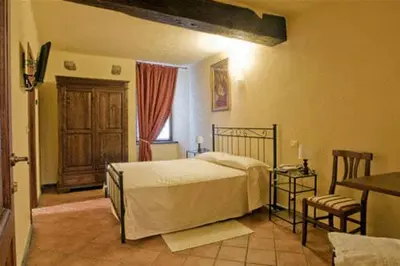 Letto o letti in una camera di La Campana D'Oro