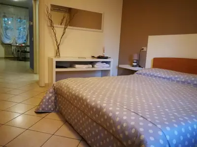 Letto o letti in una camera di B&B Covidafranciacorta