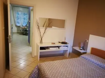Letto o letti in una camera di B&B Covidafranciacorta
