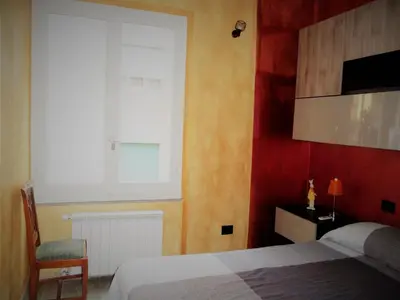 Letto o letti in una camera di rubino home