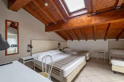 Letto o letti in una camera di Abbazia Bed & Breakfast, MantegnaHotels