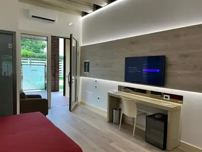 TV o dispositivi per l'intrattenimento presso Luna Residence Hotel