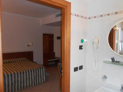 Letto o letti in una camera di Hotel La Maddalena