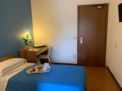 Letto o letti in una camera di Albergo Papillon