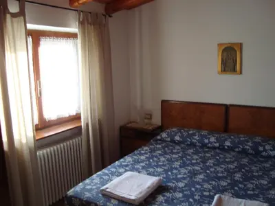 Letto o letti in una camera di Prati dei Campassi