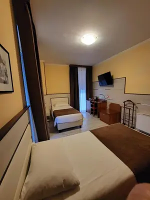 Letto o letti in una camera di Hotel Lenotel
