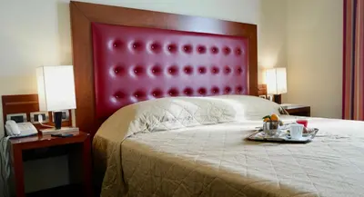 Letto o letti in una camera di Santa Caterina Park Hotel