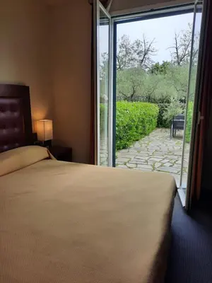 Letto o letti in una camera di Santa Caterina Park Hotel