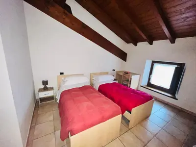 Letto o letti in una camera di Al Cacciatore