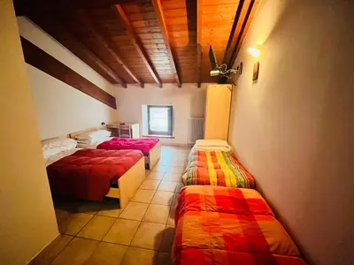 Letto o letti in una camera di Al Cacciatore
