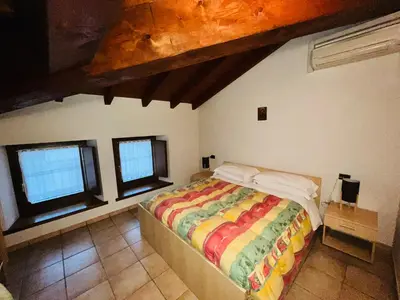 Letto o letti in una camera di Al Cacciatore
