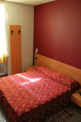 Letto o letti in una camera di Hotel San Geminiano