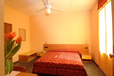 Letto o letti in una camera di Hotel San Geminiano
