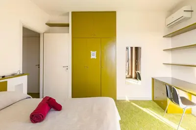 Letto o letti in una camera di Oasi di Mastarone - Il vino e le Rose