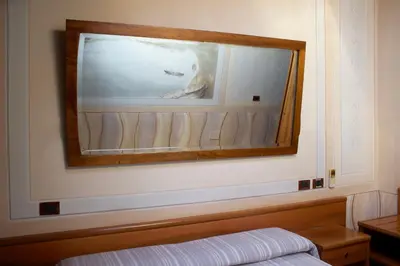 Letto o letti in una camera di Albergo Giulia Gonzaga