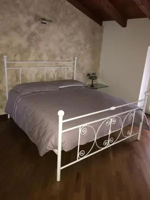Letto o letti in una camera di B&B Lodi Centro