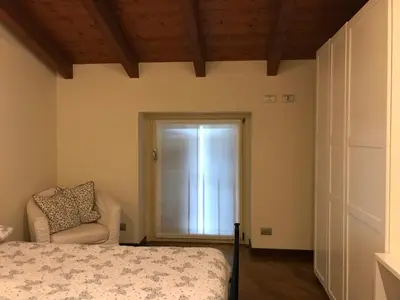 Letto o letti in una camera di B&B Lodi Centro