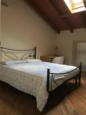 Letto o letti in una camera di B&B Lodi Centro