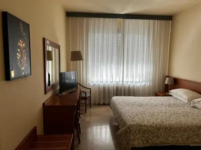 Letto o letti in una camera di Hotel Select