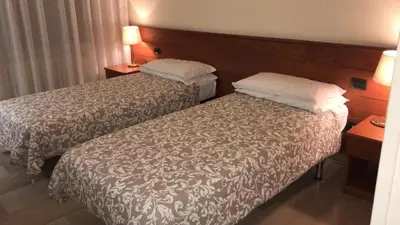 Letto o letti in una camera di Hotel Select
