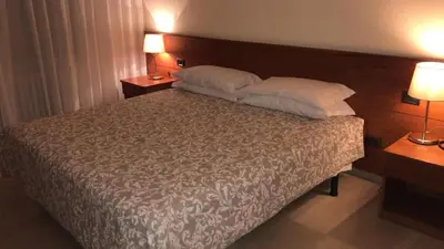 Letto o letti in una camera di Hotel Select