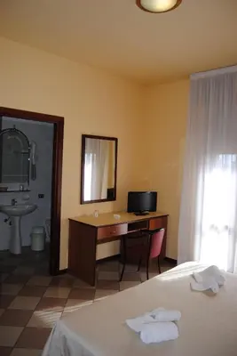 Letto o letti in una camera di Hotel La Fenice
