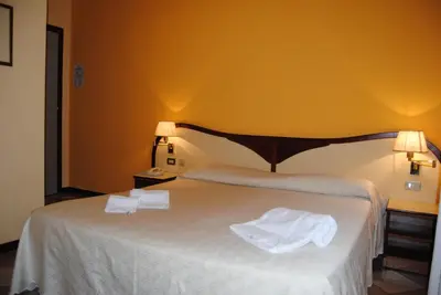 Letto o letti in una camera di Hotel La Fenice