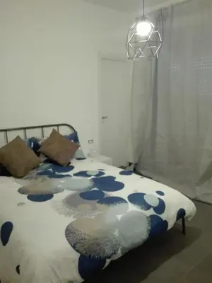Letto o letti in una camera di Sunny Home