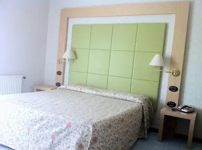 Letto o letti in una camera di Hotel Lido