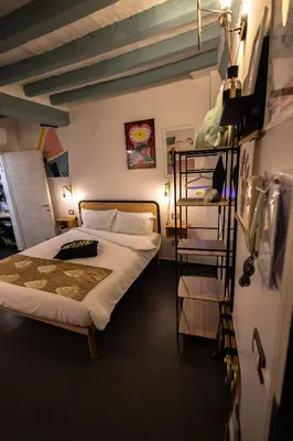 Letto o letti in una camera di La Pomposa del Teatro