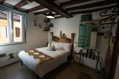 Letto o letti in una camera di La Pomposa del Teatro