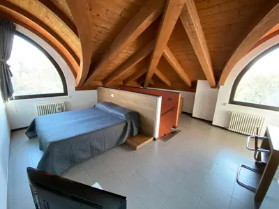Letto o letti in una camera di Residence Le Volte Apartments