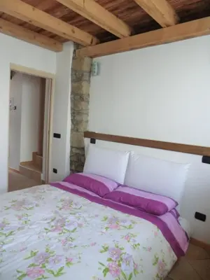 Letto o letti in una camera di B&B Le Peschiere