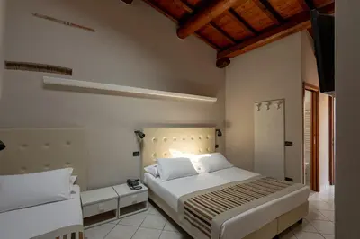 Letto o letti in una camera di Antico Residence, MantegnaHotels