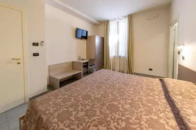 Letto o letti in una camera di La Stazione Camere Caffè