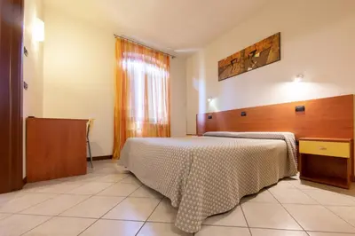 Letto o letti in una camera di La Stazione Camere Caffè