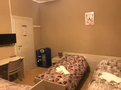 Letto o letti in una camera di Albergo centrale