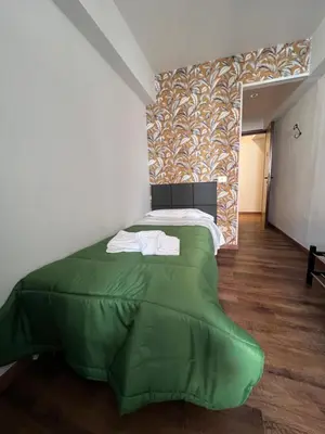 Letto o letti in una camera di Hotel Brenta