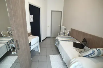Letto o letti in una camera di Hotel Villa Rosa
