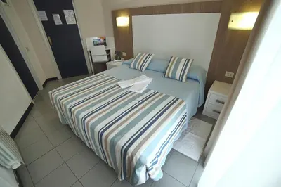 Letto o letti in una camera di Hotel Villa Rosa