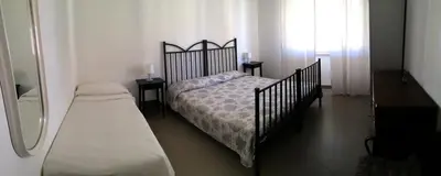 Letto o letti in una camera di Casa Liliana