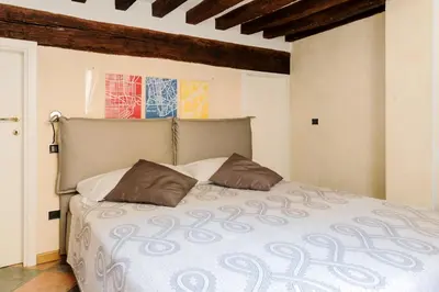 Letto o letti in una camera di PALAZZO CORDERO APARTMENT
