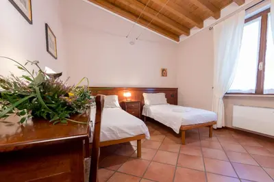 Letto o letti in una camera di Le Rondini