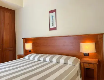 Letto o letti in una camera di Albergo Degli Amici